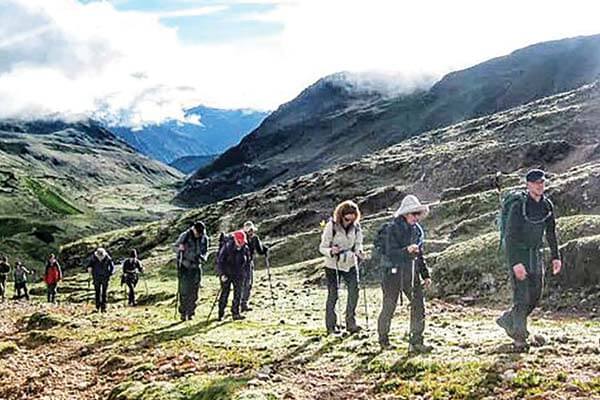 the group of walkers walking through Peru